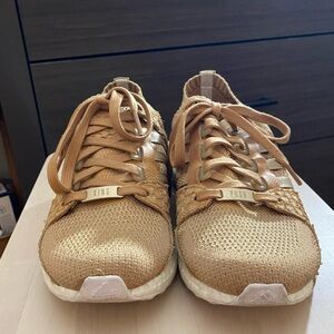 Adidas “King Push” gold tennis shoes